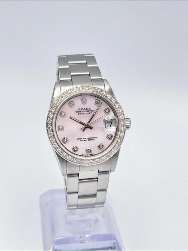photo de Montre Rolex Datejust 31 mm pour femme, cadran en nacre rose, lunette en diamants